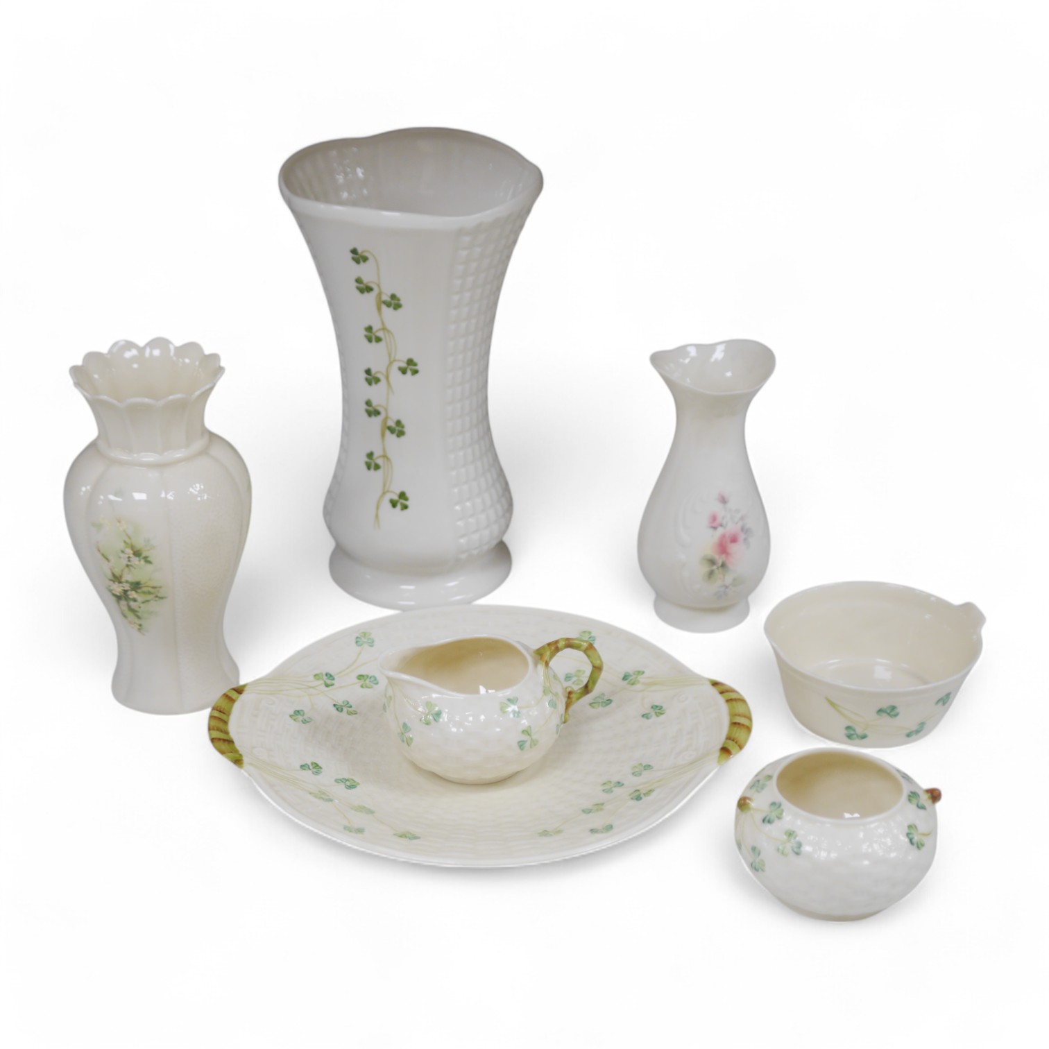 A Belleek serving plate, milk jug and two bowls and three Donegal vases, tallest item 25cm high. Condition - good